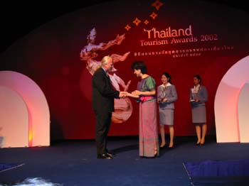 Anthony James receives Friend of Thailand Award from Royal Thai Department of Commerce and TAT September 27, 2002